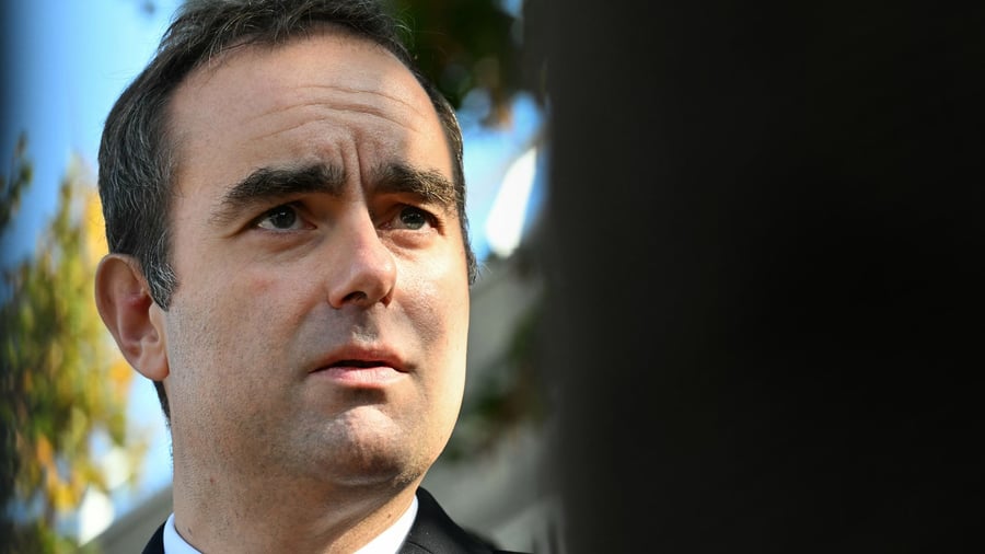 France retains ministers, faces vote