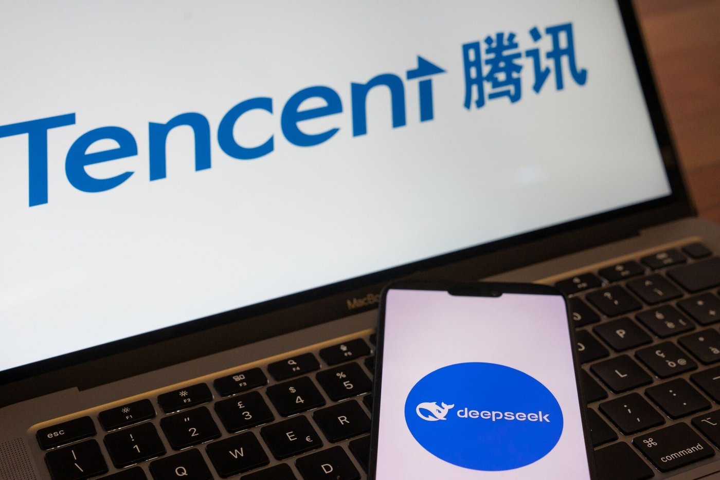 the-logos-for-the-deepseek-ai-service-bottom-and-tencent-holdings-ltd-arranged-in-beijing-china.jpeg