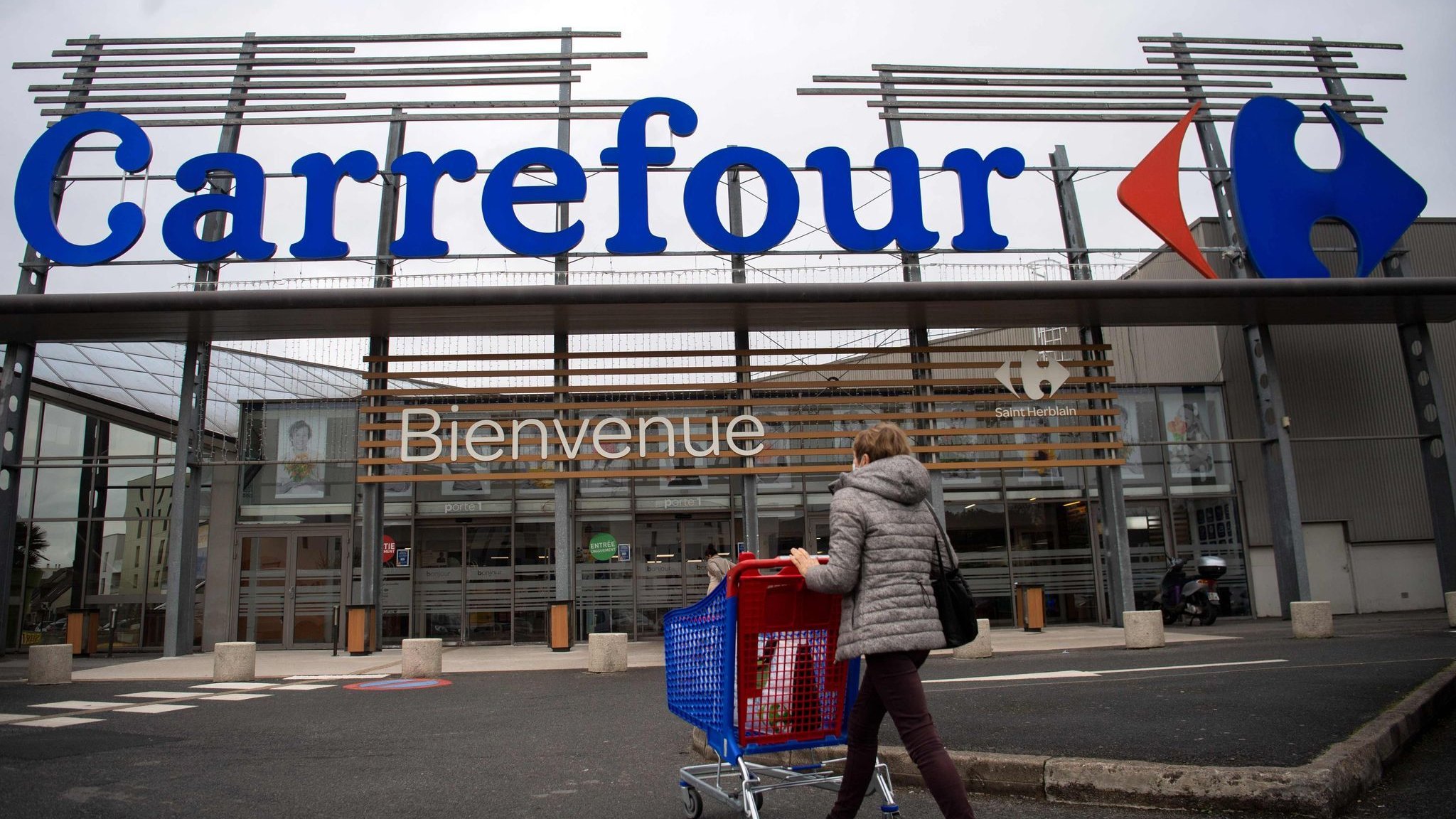 Carrefour cuts forecasts after riots and looting in France